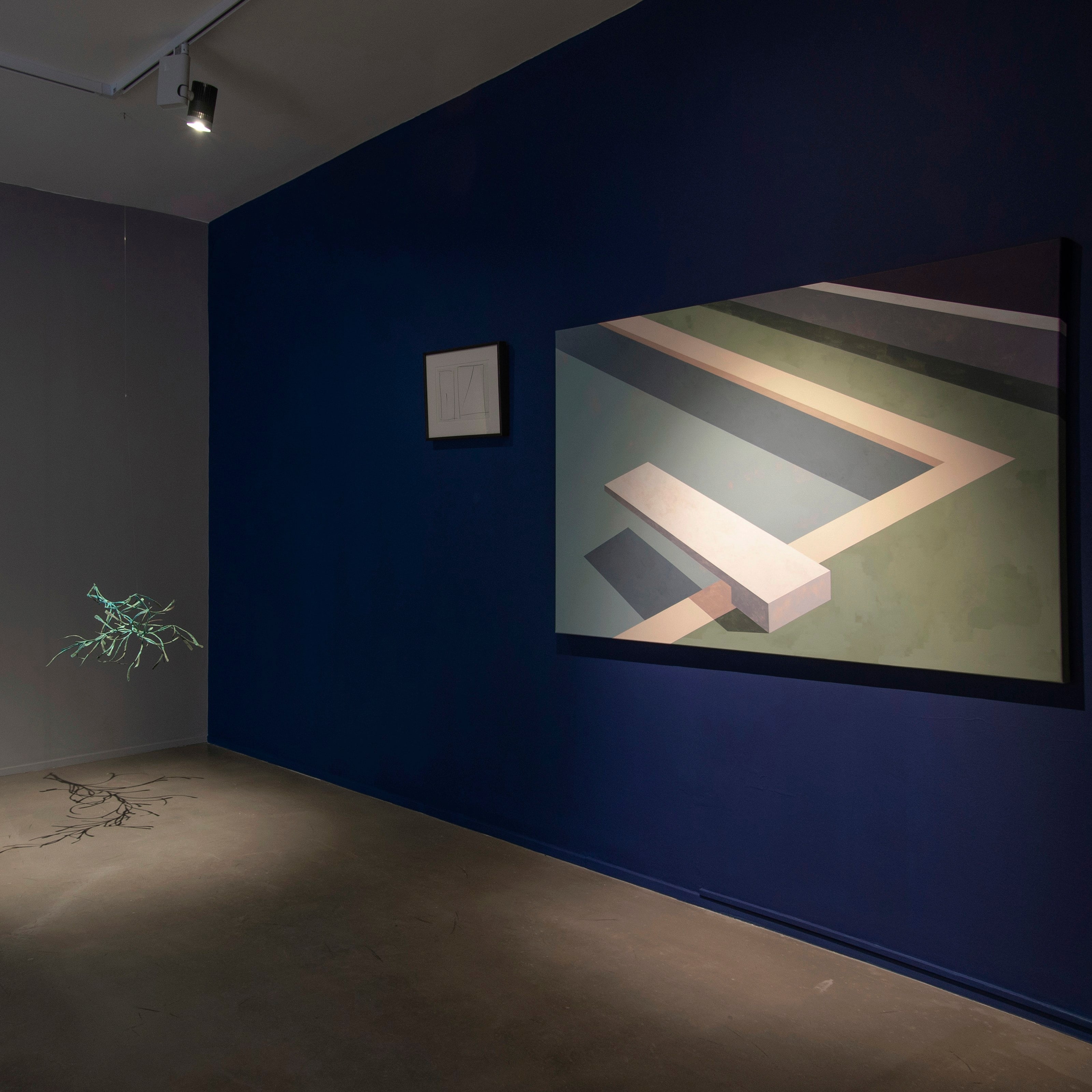 Large painting of an empty swimming pool by Ufuk Yılmaz on a navy blue gallery wall