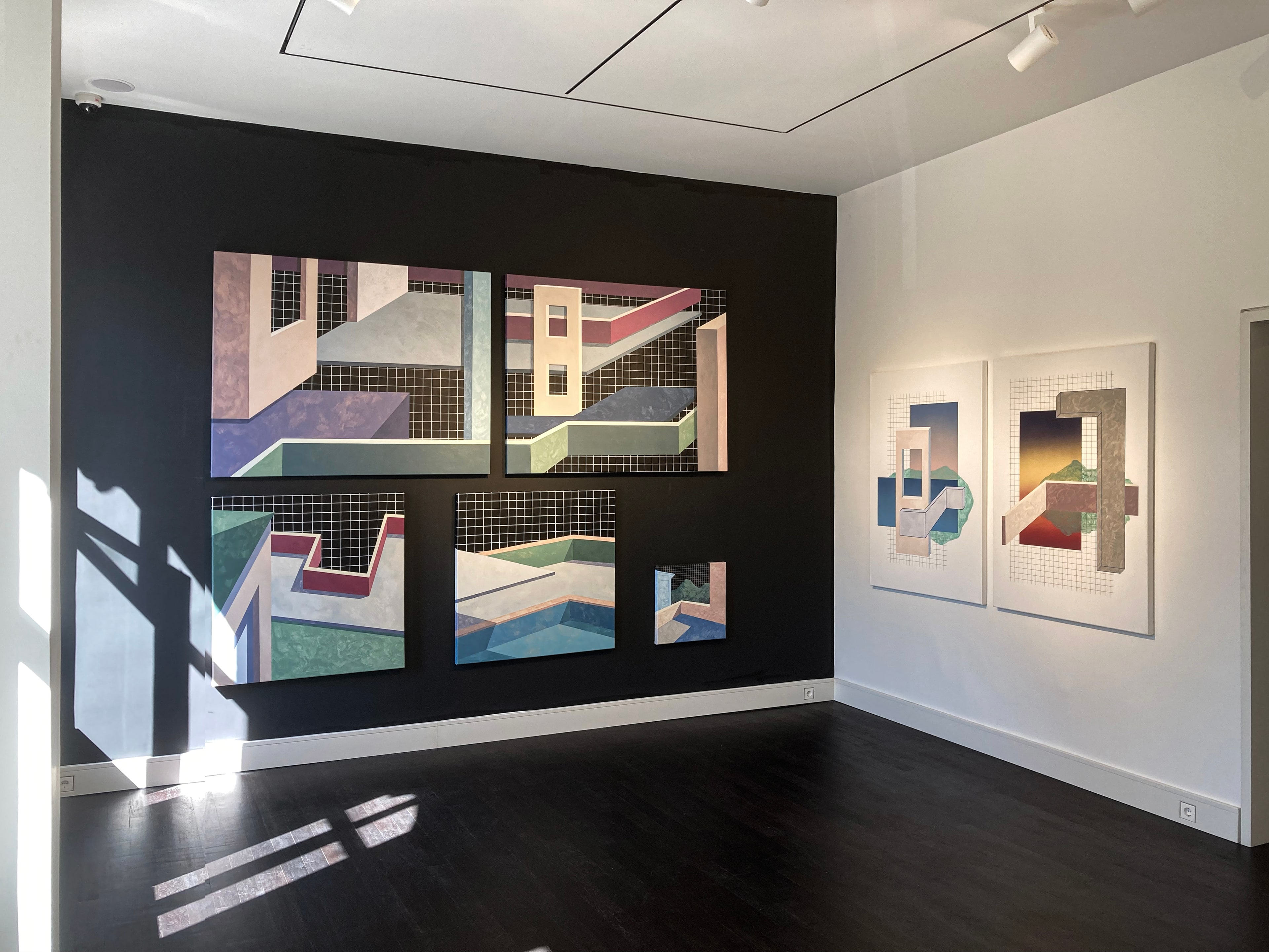 Layers series by Ufuk Yılmaz, installation view on a black gallery wall
