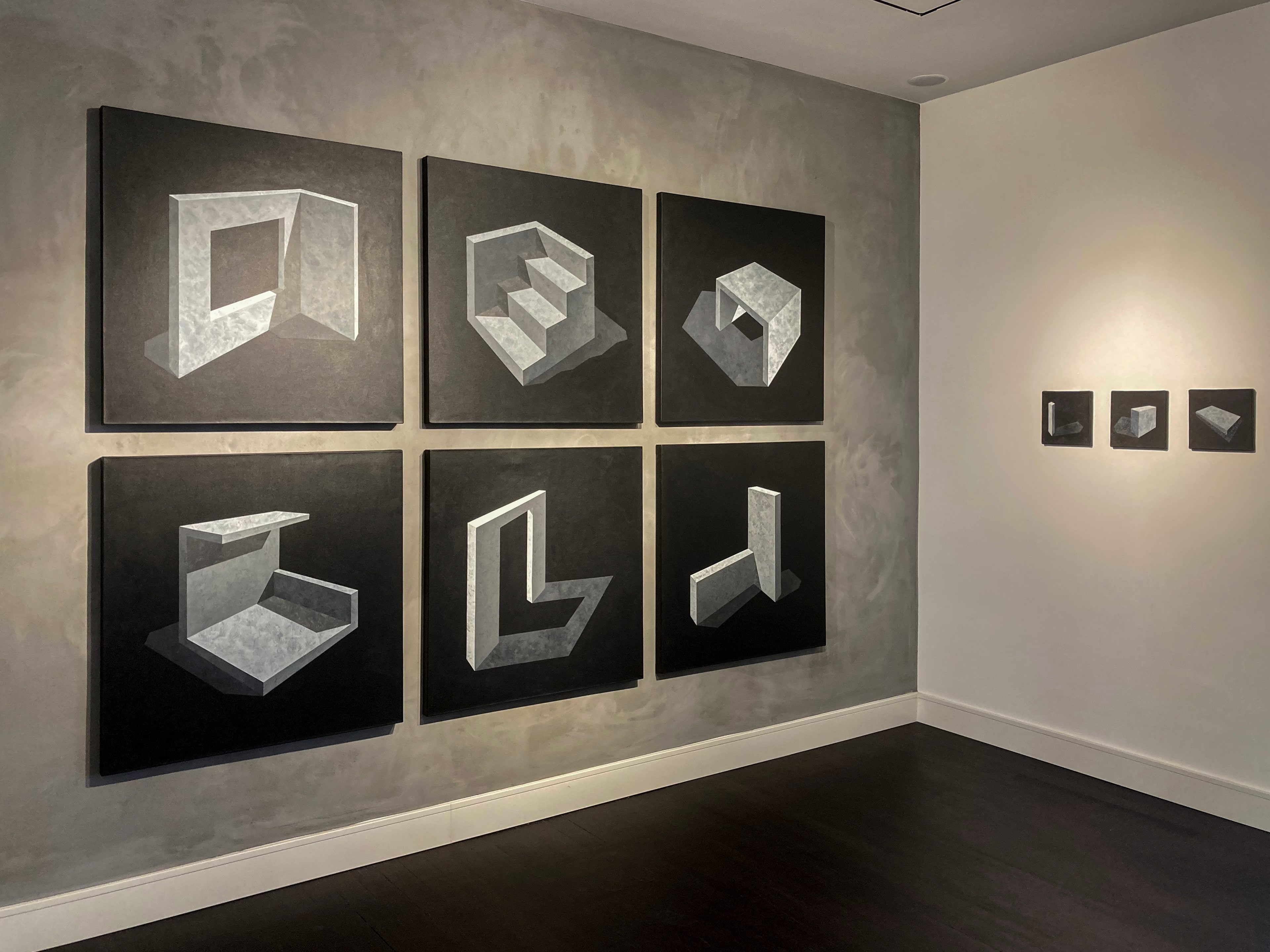 Mass series by Ufuk Yılmaz, six black-and-white paintings on a grey wall